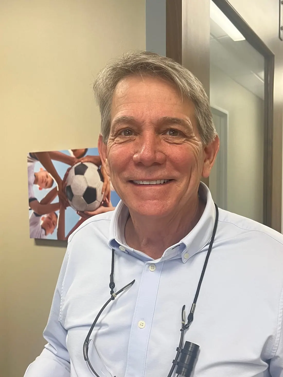 Dr. Devin Cochran reviewing a treatment result at his San Antonio office