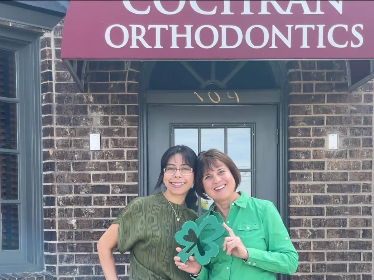 Cochran Orthodontics team members outside the Blanco Rd office